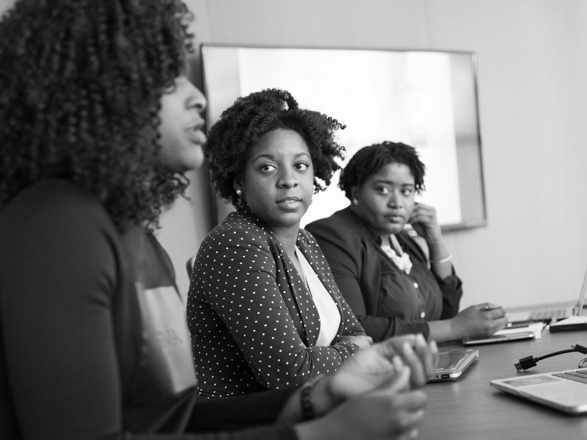 Professionals listening in a conference room